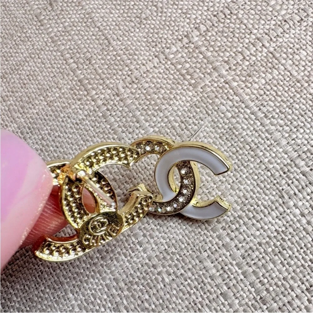 CHANEL White Enamel and Gold Logo Crystal Stud Earrings